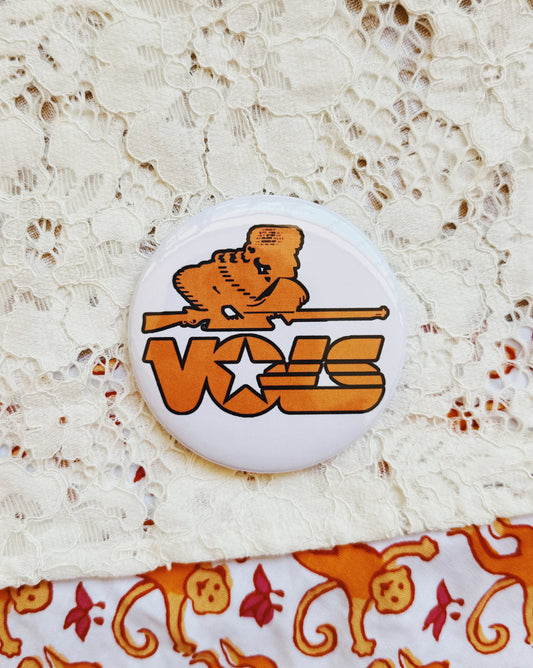 Vols Button